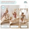 Drewniany domowy plac zabaw ze zjeżdżalnią, ścianką wspinaczkową i huśtawką
